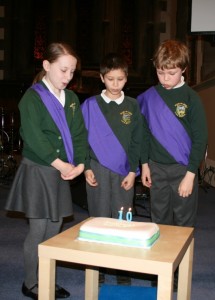 Photo of children cutting the cake